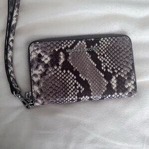 Michael Kors wristlet. Snake print, very clean and lightly used. Super cute!